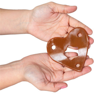 String coeur jelly comestible Chocolat unisex dans les mains